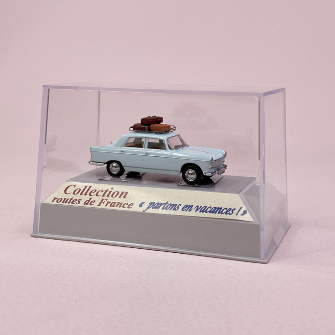 Peugeot 404 bleu pastel, galerie et valises - SAI 1822 - HO 1/87